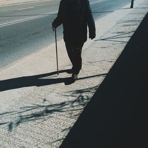 Shadow of people on road