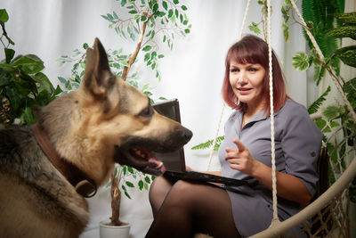 Portrait of young woman with dog