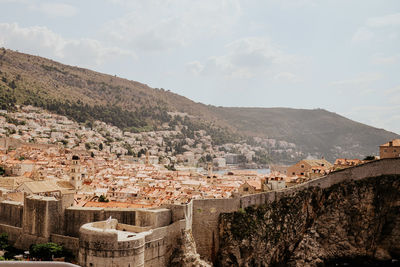 Aerial view of townscape against sky