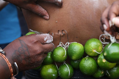 Close-up of hand holding fruit