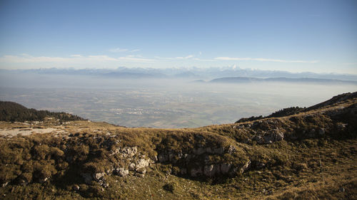 Scenic view of landscape against sky during foggy weather