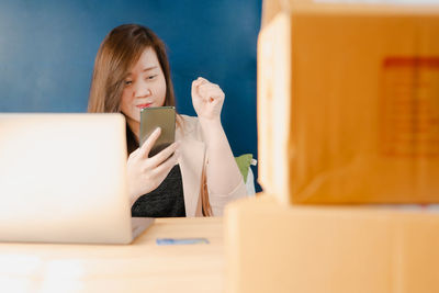 Young woman using mobile phone