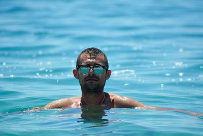 Portrait of man swimming in sea