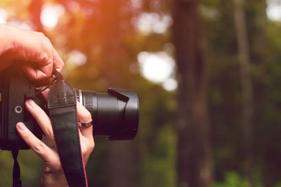 Close-up of hand holding camera