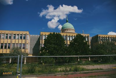 Buildings in city against sky