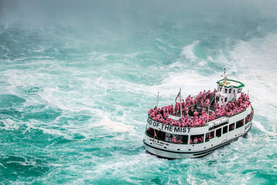 High angle view of ship sailing in sea