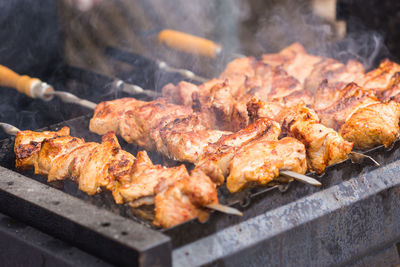 High angle view of meat on barbecue grill