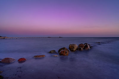 Scenic view of sea against sky at sunset