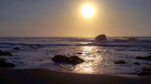 Scenic view of sea against sky during sunset