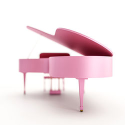 Close-up of piano against white background