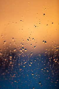 Full frame shot of wet glass window during rainy season