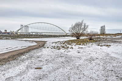 River, floodplain and bridge in winter