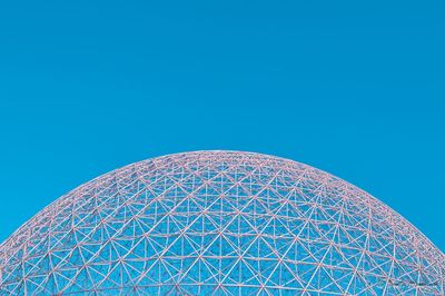 Low angle view of built structure against clear blue sky