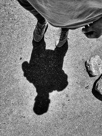 Low section of people walking on road