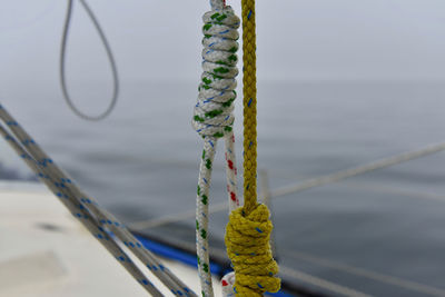 Close-up of rope tied to pole