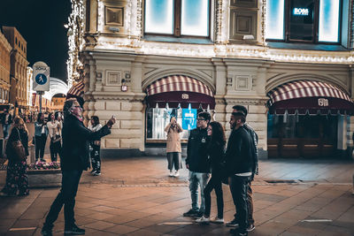 People standing on street in city