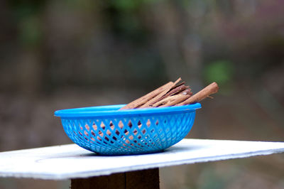 Close-up of blue bowl on table