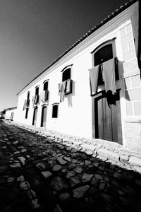 Low angle view of clothes drying on building