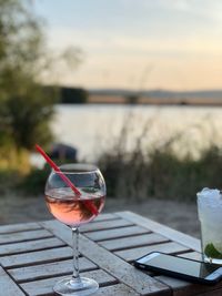 Close-up of drink on table at swimming pool