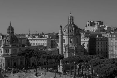 Panoramic view of buildings in city against clear sky