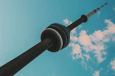 Low angle view of communications tower against sky