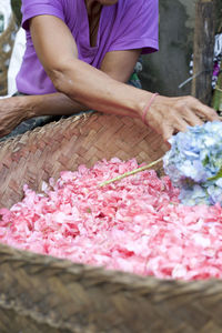 Midsection of woman working with flowers