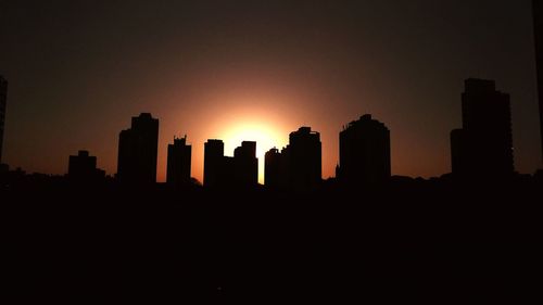 Silhouette of buildings at sunset