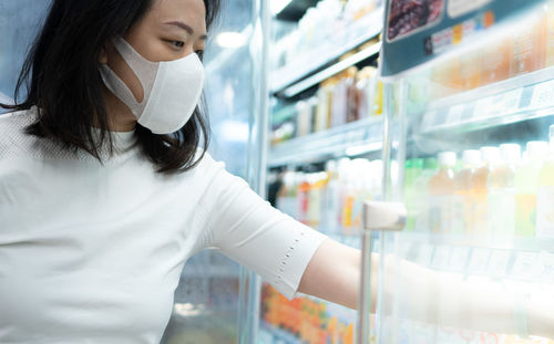 Midsection of woman standing in store