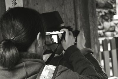 Photographer photographing through camera