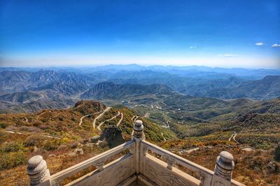 Rear view of man looking at mountain range