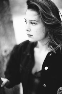 Portrait of young woman looking away