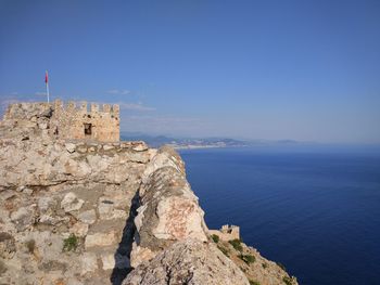 Scenic view of sea and buildings against sky