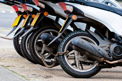 Close-up of motorcycle on road