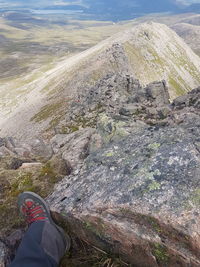 Low section of person on rock