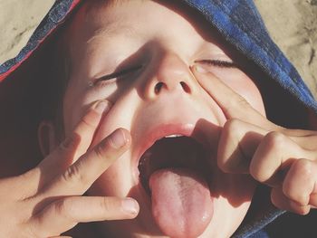 Close-up of boy with mouth open