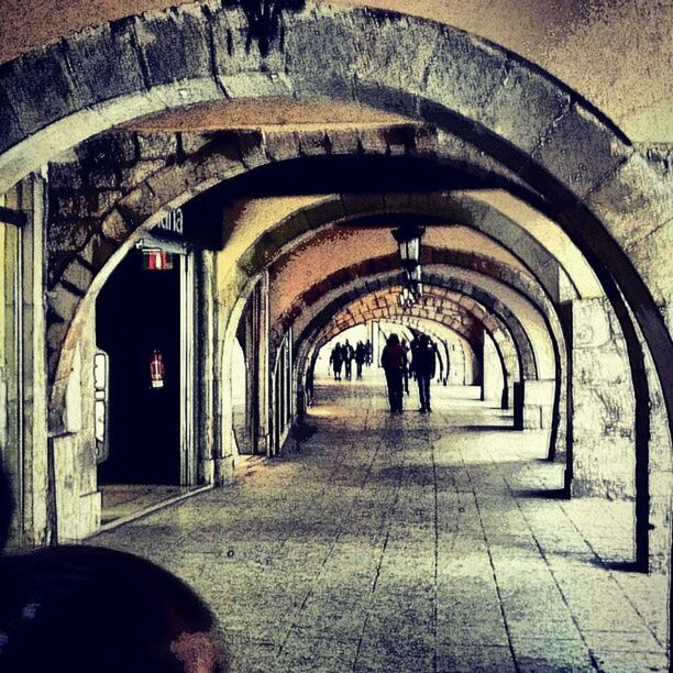 indoors, arch, architecture, built structure, tunnel, men, walking, the way forward, archway, full length, architectural column, corridor, lifestyles, rear view, person, ceiling, silhouette, arched