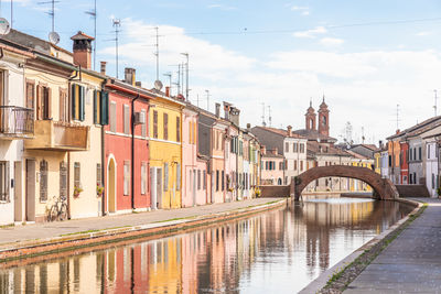 Canal amidst buildings in city