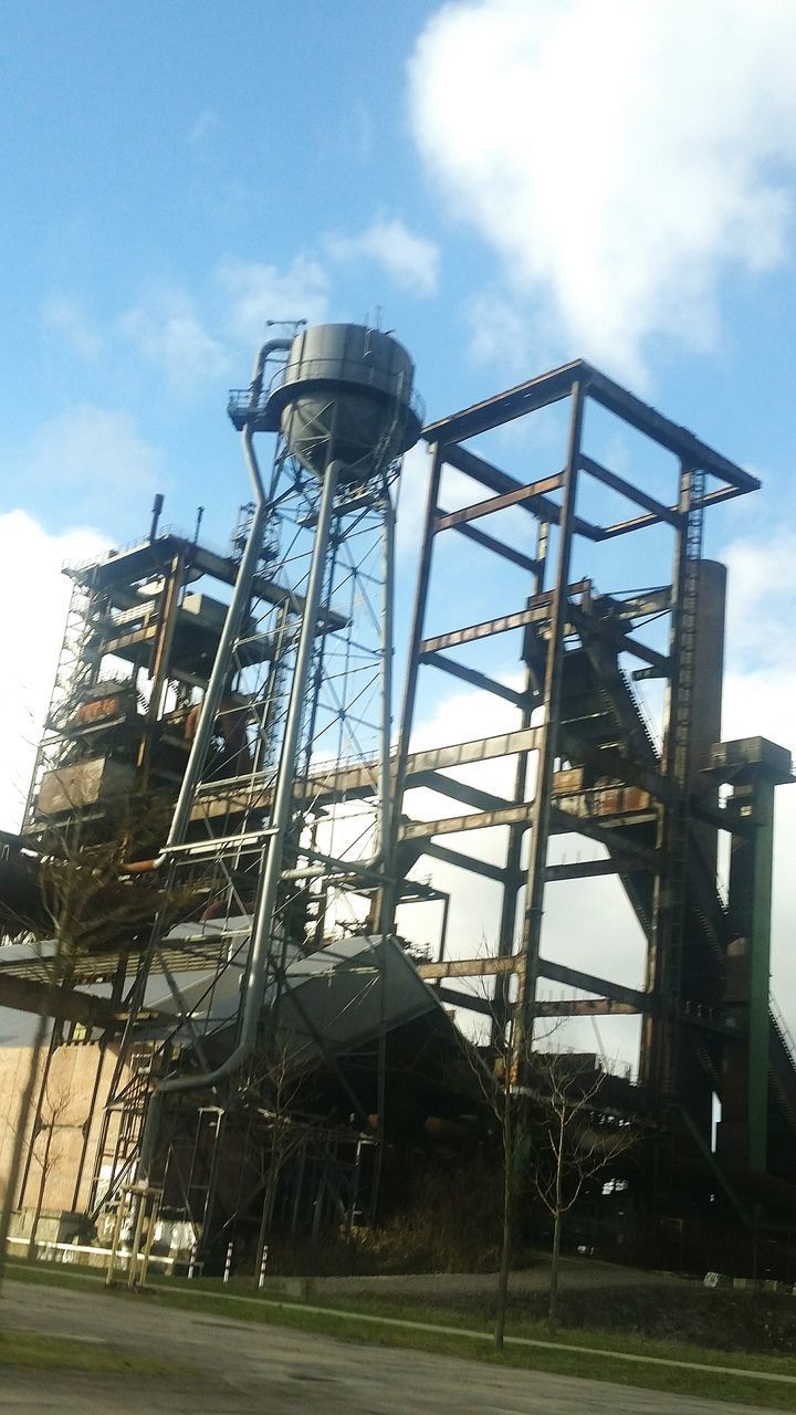 LOW ANGLE VIEW OF CHAIN SWING RIDE AGAINST SKY