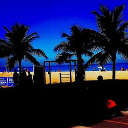 Palm trees against blue sky