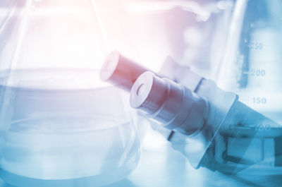 Double exposure of laboratory equipment on table