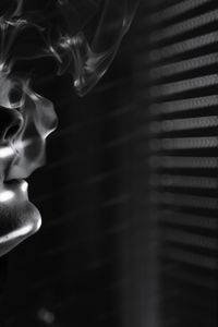 Low angle view of illuminated lighting equipment on window