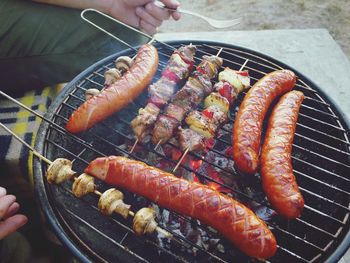 Close-up of sausages on barbecue grill