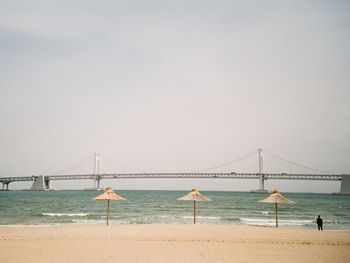 Scenic view of beach against clear sky