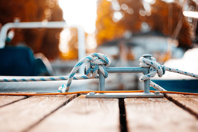 Close-up of rope tied on metal railing