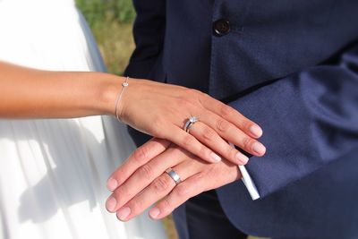 Close-up of couple holding hands