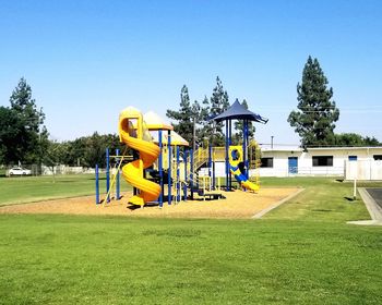 View of playground against clear sky