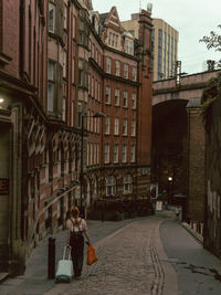 People walking on street in city