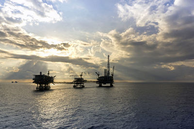 Silhouette of an oil production platform during sunset at offshore terengganu oil field