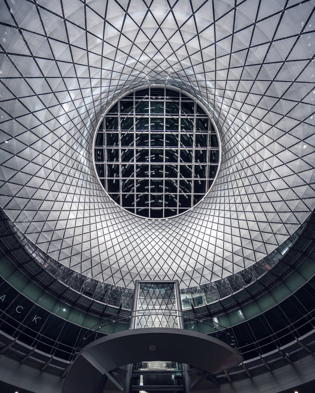 indoors, architecture, built structure, pattern, ceiling, circle, design, low angle view, architectural feature, geometric shape, directly below, backgrounds, full frame, skylight, shape, building exterior, building, ornate, no people, arch