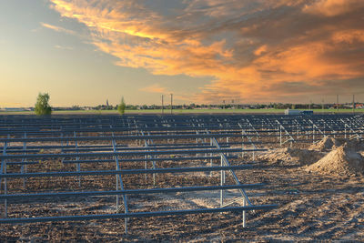 Scenic view of field against sky during sunset